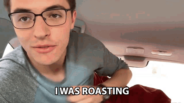 a man wearing glasses says i was roasting while sitting in a car