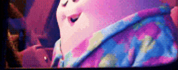 a close up of a cartoon character wearing a blue and purple pajama shirt .