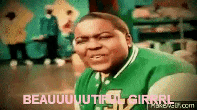 a man in a green shirt is making a funny face and says beautiful girrl
