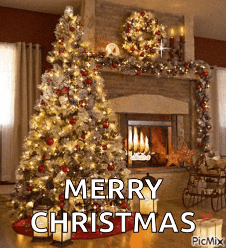 a christmas tree is in front of a fireplace with the words merry christmas written on it