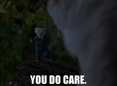 a person standing on top of a rock with the words you do care below them .