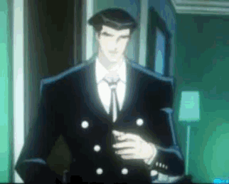 a man in a suit and tie stands in a room