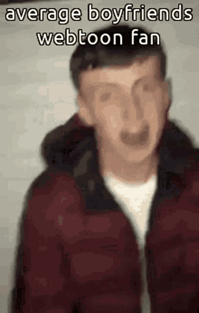 a blurry picture of a man in a red jacket with the words `` average boyfriends webtoon fan '' written on it .