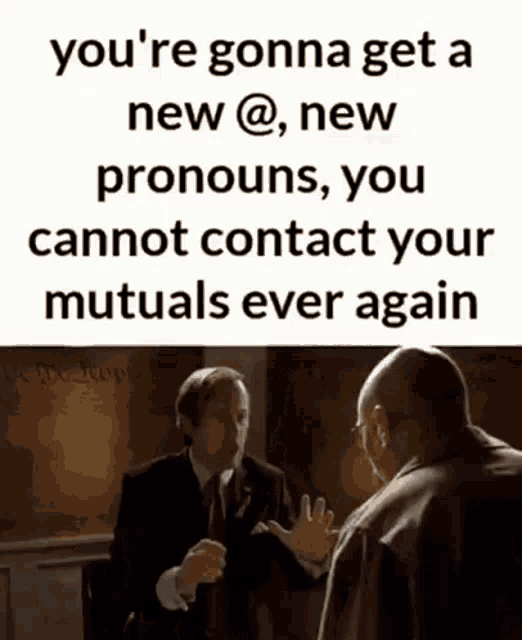a man in a suit is talking to another man in a suit .