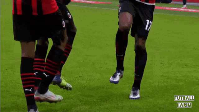 a group of soccer players wearing acm socks stand on a field