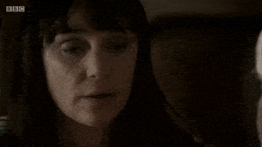 a close up of a woman 's face with bbc on the bottom right