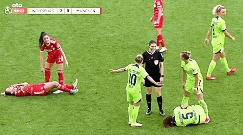 a soccer game between wolfsburg and munchen is going on