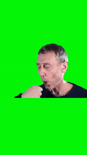 a man is blowing a kiss on a green screen while wearing a black sweater .