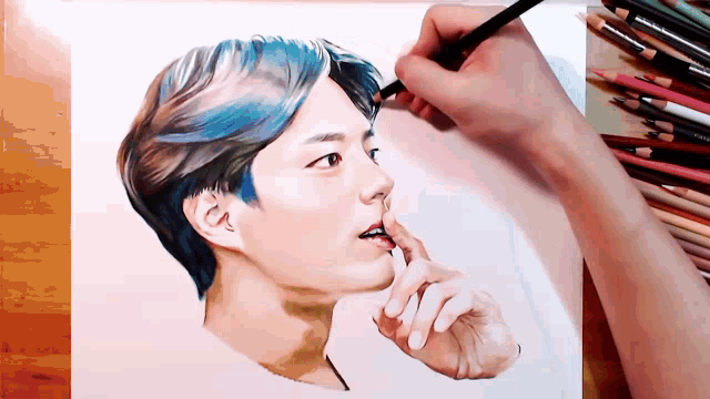 a drawing of a man with blue hair is being drawn on a piece of paper