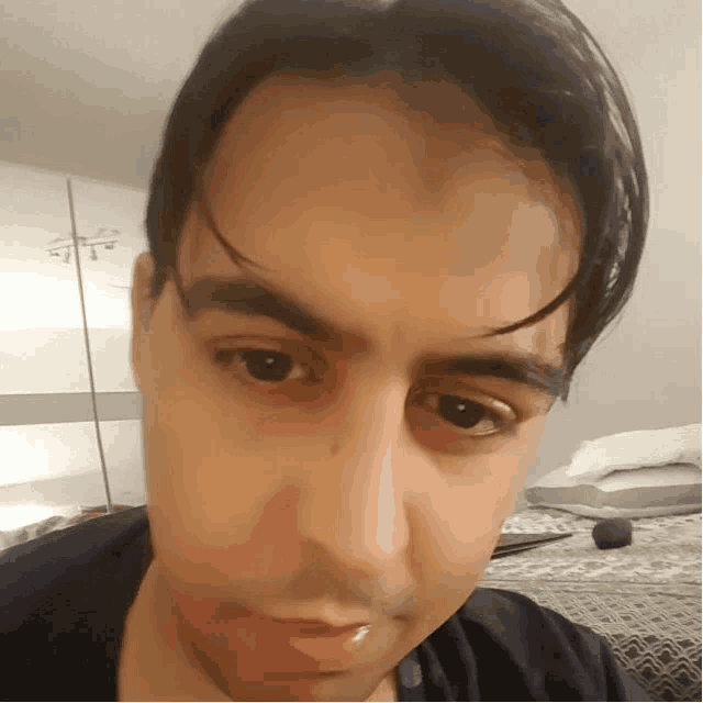 a close up of a man 's face with a blurred background