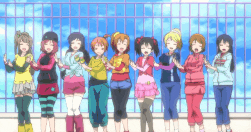 a group of anime girls are standing in front of a fence