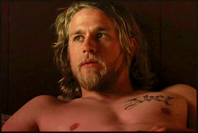 a shirtless man with a tattoo on his chest that says ' jet ' on it