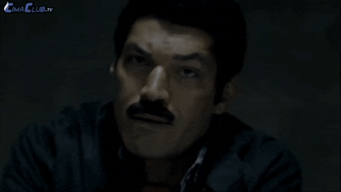 a man with a mustache says fils de pute in french