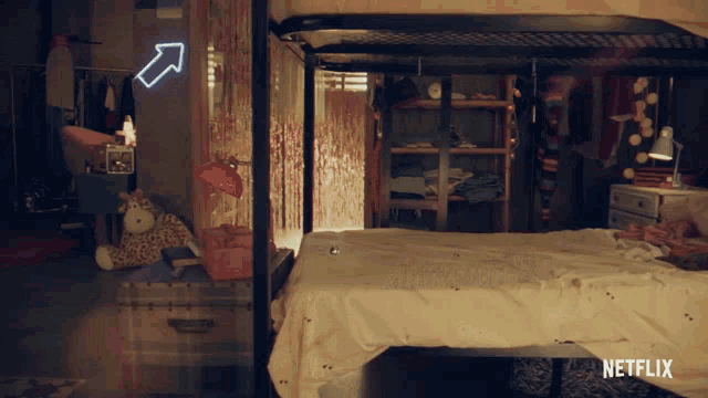 a bedroom with a bunk bed and a netflix logo on the bottom
