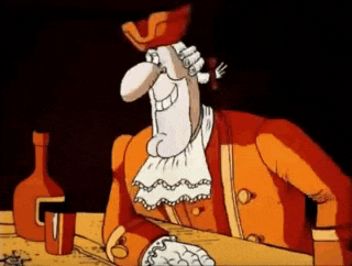 a cartoon character is sitting at a table with a bottle of liquor .