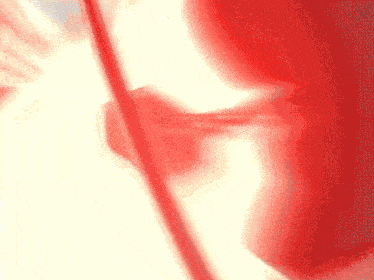 a close up of a red and white background