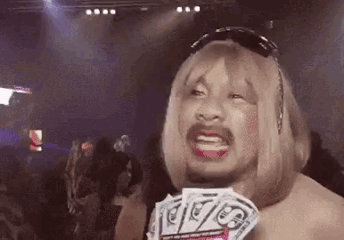 a man in a wig is holding a bunch of money in his hand ..