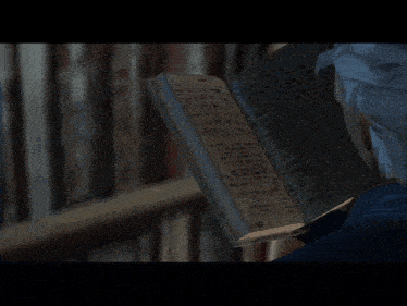 a man holding a book with the words that 's not what i 'm looking for on the bottom