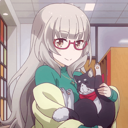 a girl with glasses is holding a cat