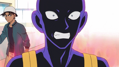 a man in a white hat stands next to a man in a purple suit