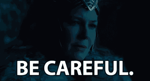 a woman wearing a helmet with the words be careful on it