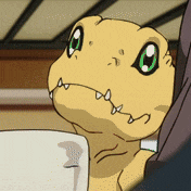 a close up of a cartoon character 's face with green eyes