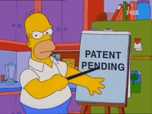 homer simpson pointing at a white board that says patent pending