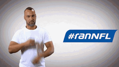 a man in a white shirt is clapping in front of a #fannfl logo