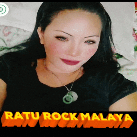 a woman laying on a bed with the words ratu rock malaya on the bottom right