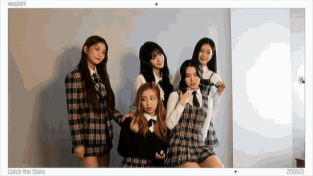 a group of girls posing for a picture with the date 200513 on the bottom