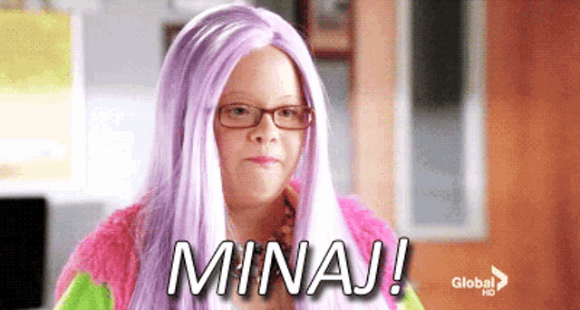 a girl wearing glasses and a purple wig says mina !