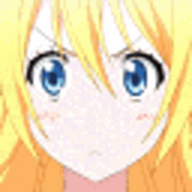 a close up of a girl with blonde hair and blue eyes making a funny face with her mouth open .