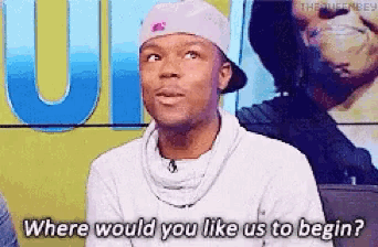a man wearing a hat and sweater says where would you like us to begin