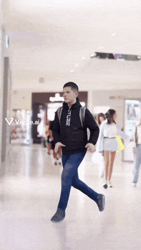 a man wearing a black jacket with the word emporio on it