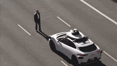 a white car with a black object on the top of it