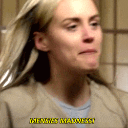 a close up of a woman 's face with the words mensies madness in yellow letters