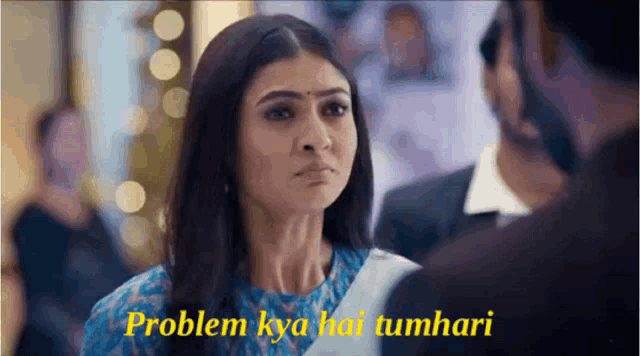 a woman is looking at a man with the words problem kya hai tumhari written on the bottom