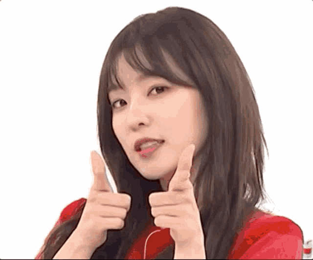 a young woman in a red shirt is giving a thumbs up .