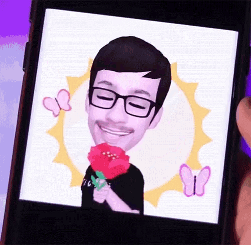 a man with glasses and a mustache is holding a flower in his hand