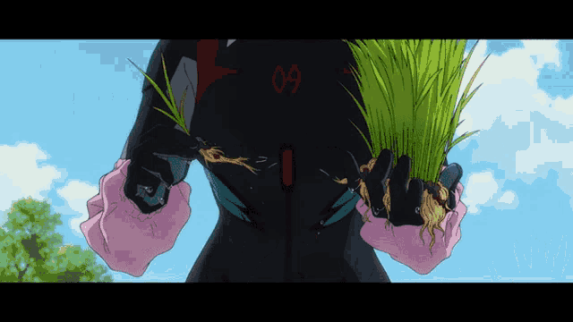 a person with the number 09 on their back holds a plant