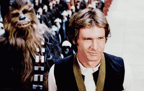 han solo and chewbacca are standing next to each other in a star wars scene