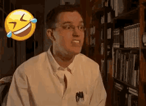 a man with glasses is laughing with a smiley face behind him