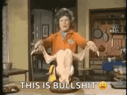 a woman is holding a dead chicken on a table and saying `` this is bullshit '' .