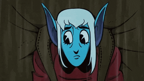 a cartoon character with blue ears and a red shirt is sitting on a couch .
