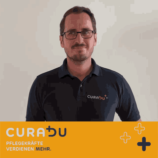 a man wearing glasses and a shirt that says curabu on it