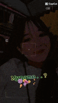 a woman 's face is being captured by a camera with the words myname written below her