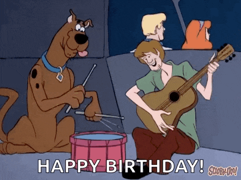 scooby doo and shaggy are playing drums and playing a guitar .