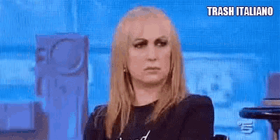 a woman is making a funny face and saying no no on a television show .