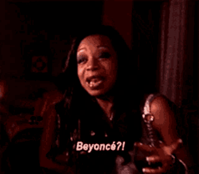 a close up of a woman 's face with the words beyonce written on it
