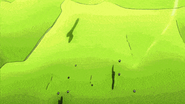 a group of people standing on a green field